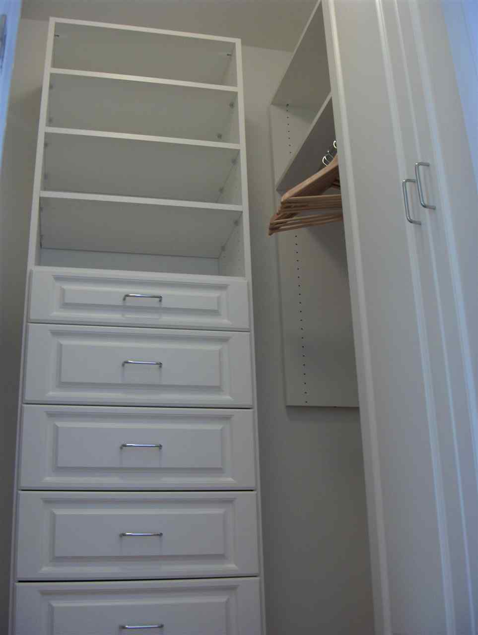 resized-2349823-Master Closet Hers.JPG
